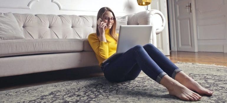 Woman looking on line for solutions on moving from NYC to CT 