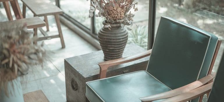 An armchair and a vase.