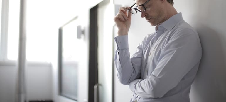 stressed man thinking how to prepare for last minute relocation to New Jersey