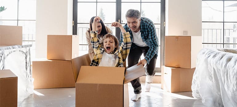 family having fun while waiting for movers Sunnyside NY