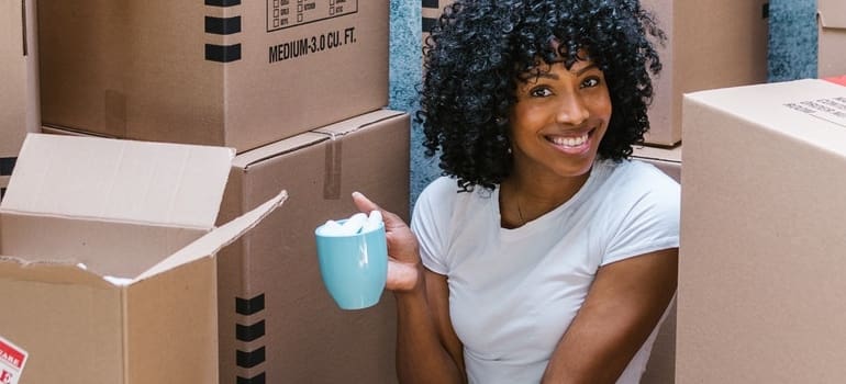 a smiling girl thinking how to pick the right movers in Dumbo
