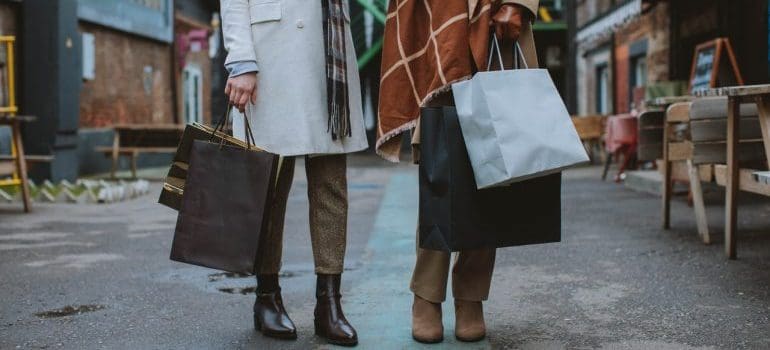 Two woman holding shopping bags