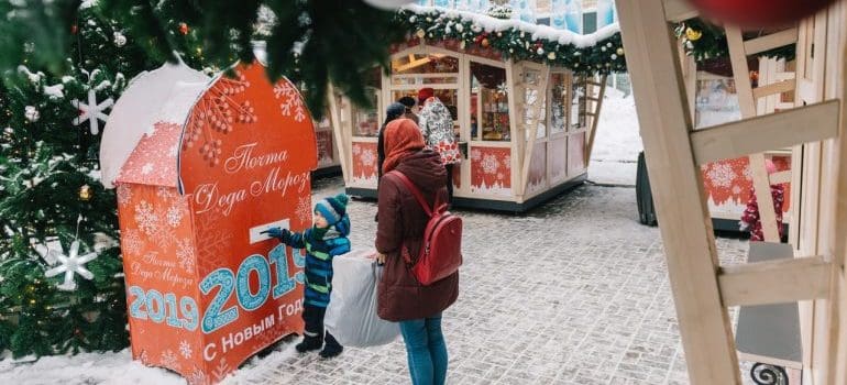 Mother and son in a Christmas market.