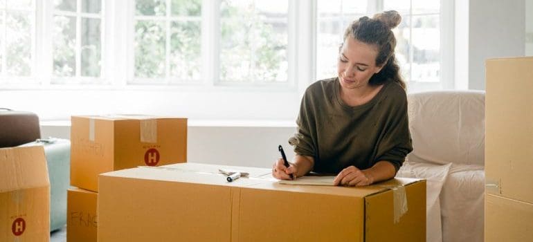 A woman packing for a move.