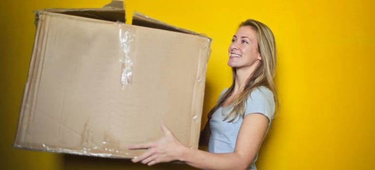 A girl holding a box