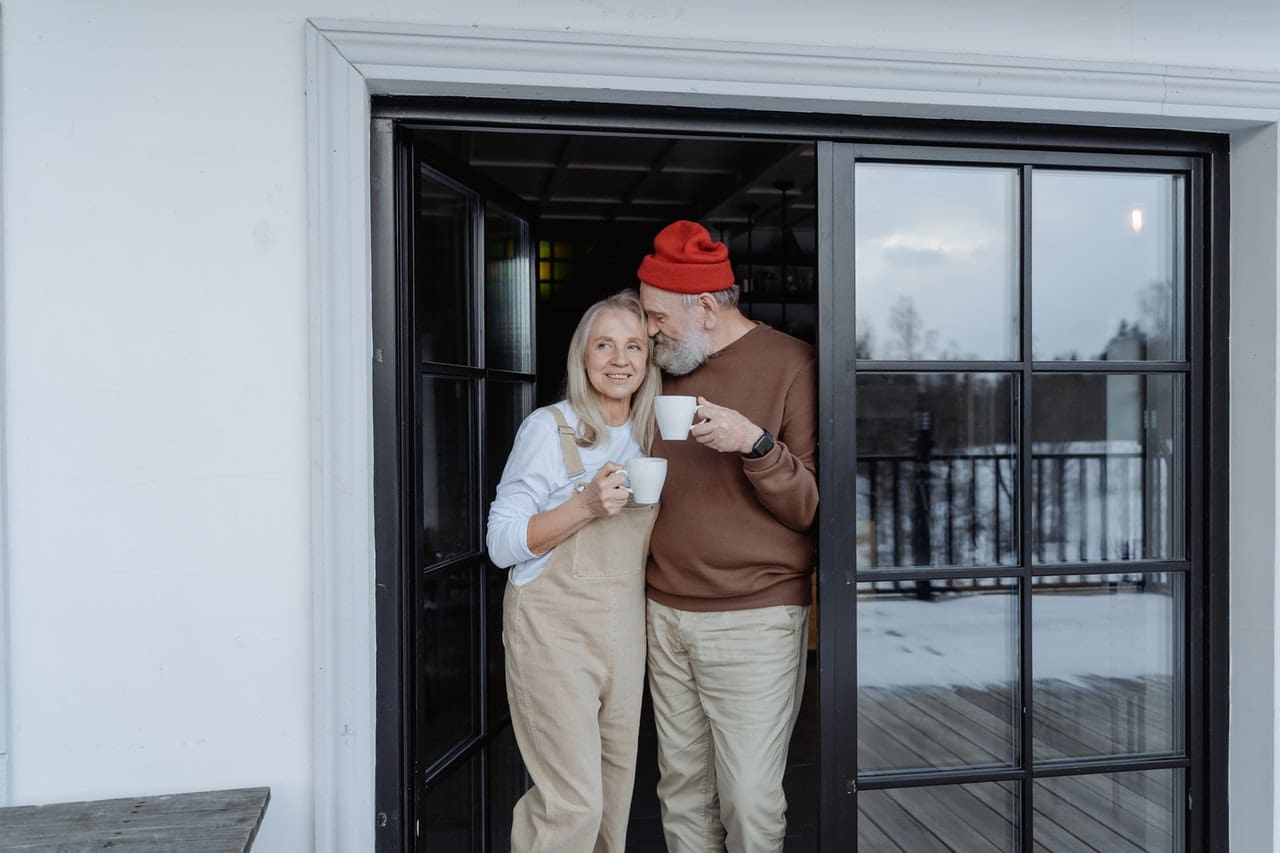 A happy couple enjoying their new home after moving from NYC to a small town.