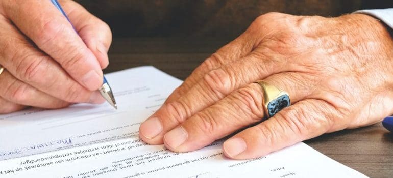 A man signing a contract