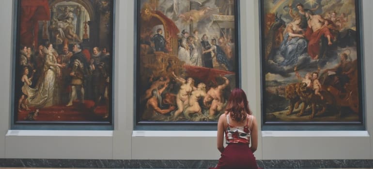 A woman looking at art