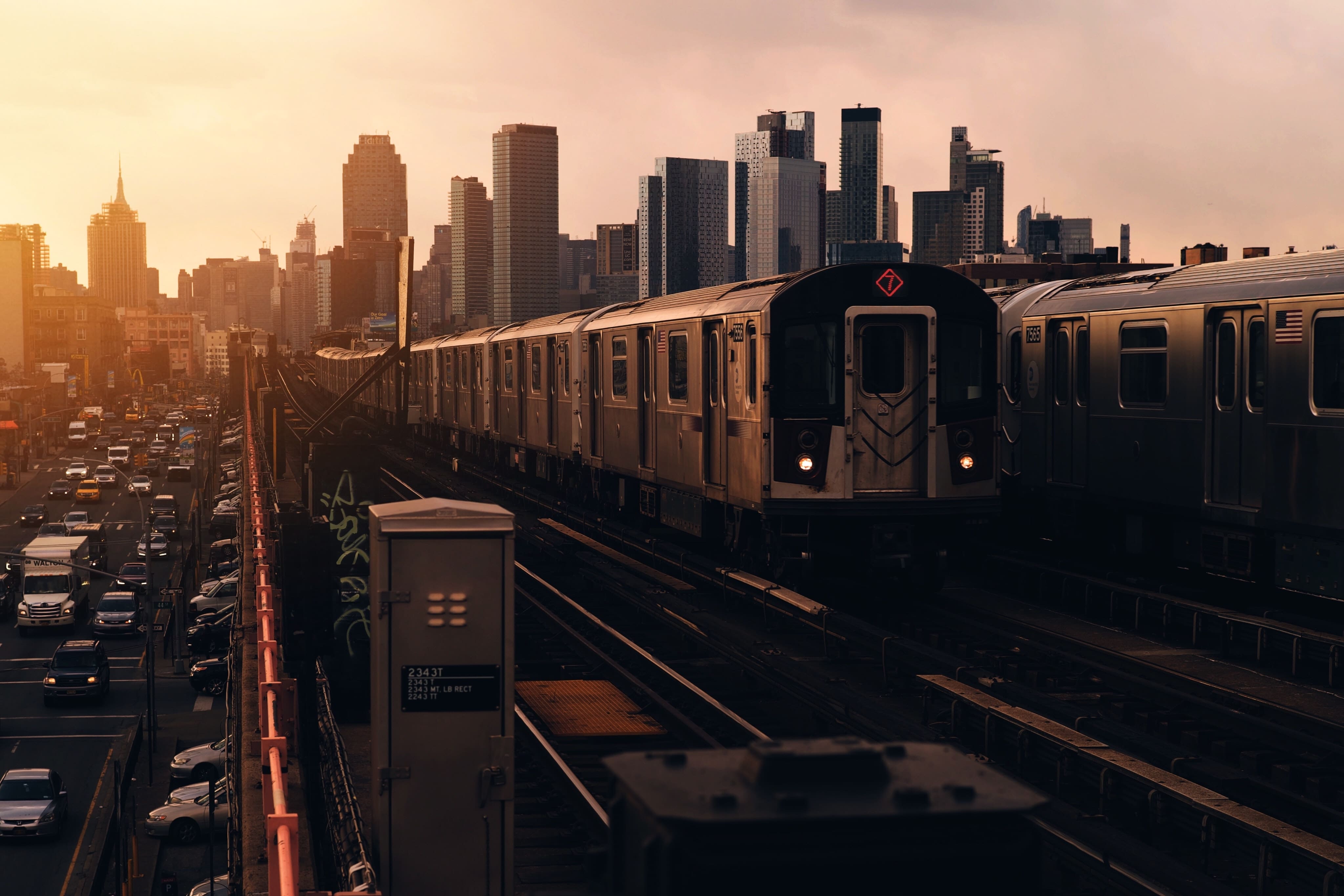 riding a train as benefits of living in Queens