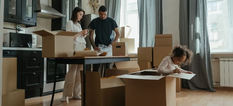 a family of three preparing to pack your kitchen