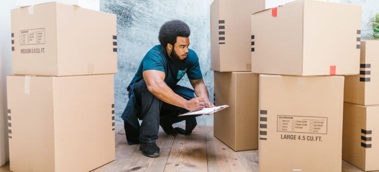 A mover checking on the moving boxes