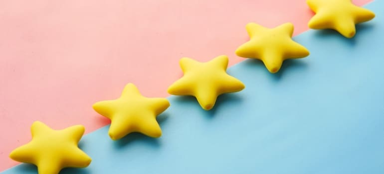 Five stars on a pink and blue background