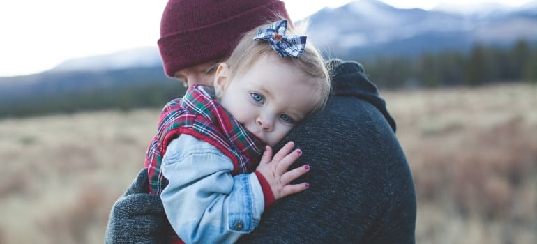 kid and father hugging