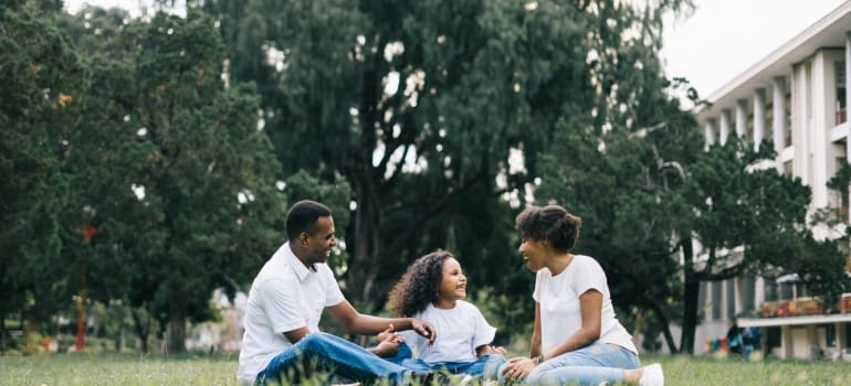 Family sitting on the gras
