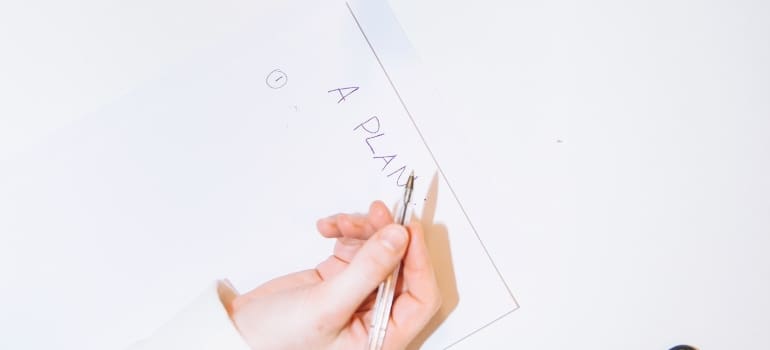 a woman writing a plan