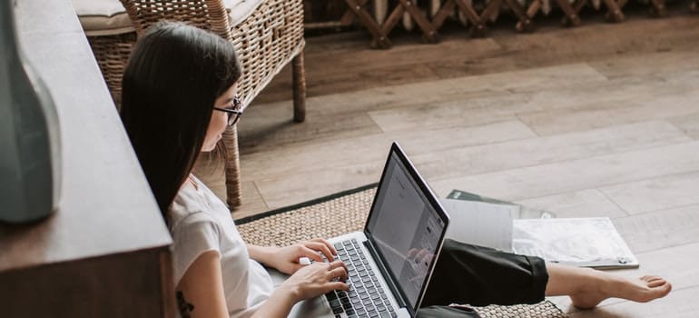 A woman doing some research on her laptop