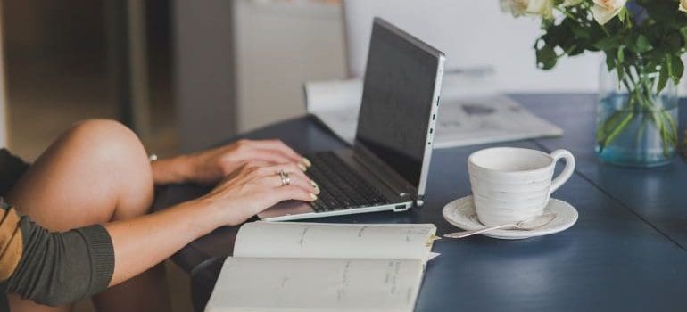 a woman typing on a laptop at home showing that New Jersey is perfect for remote workers