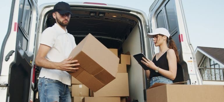 two movers loading the truck