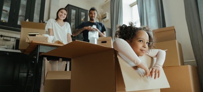 a family packing for the move and thinking of Astoria vs Sunnyside neighborhoods