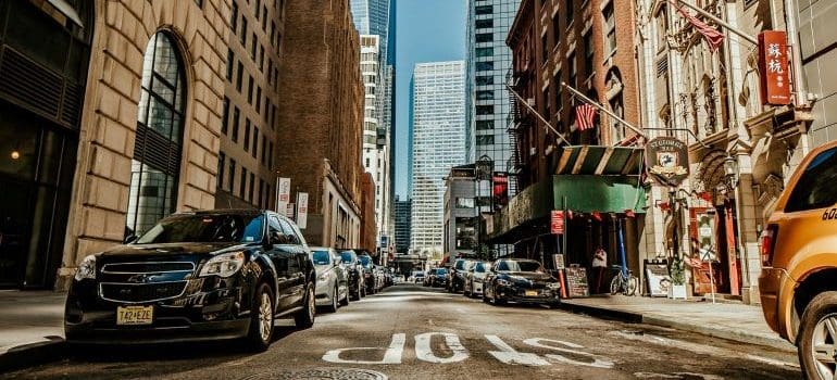 a street with tall buildings in NYC