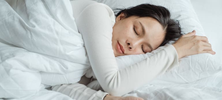 a girl taking a nap as a way to relax after relocating to Brownsville