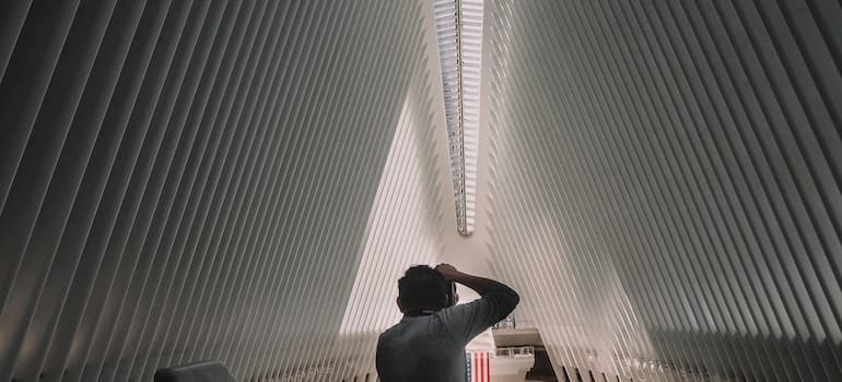 a man taking photo in a museum