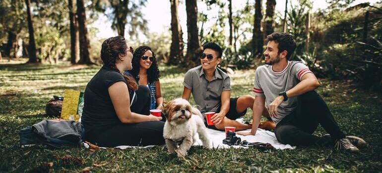 Group of people sitting with a dog