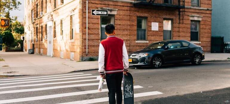 person crossing the street when moving from Manhattan to Forest Hills