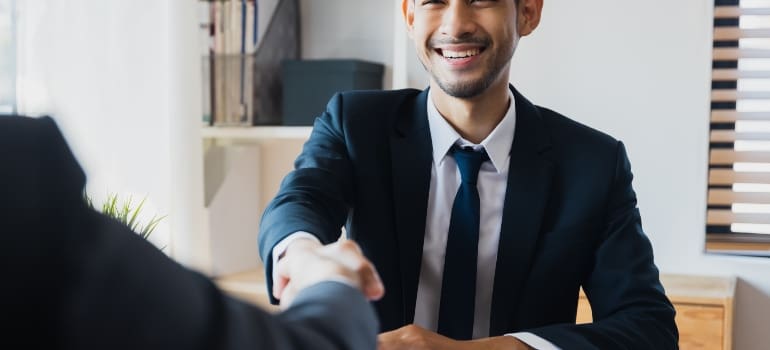 Man signing a contract with movers Manhattan