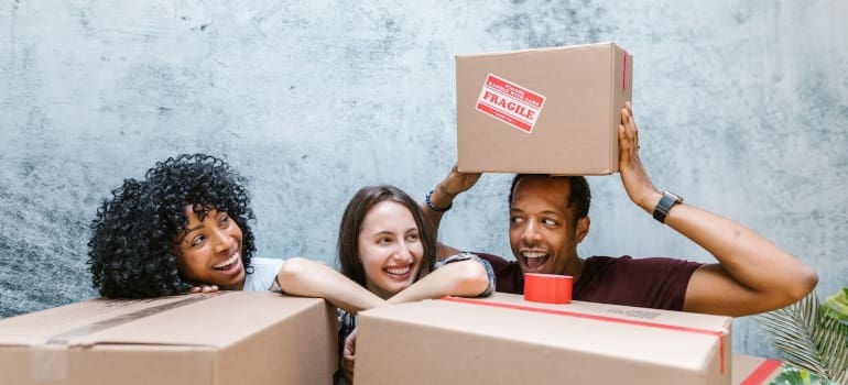 happy people behind boxes