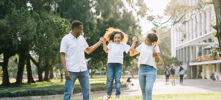 parents playing with their daughters