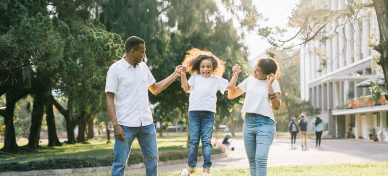 parents playing with their daughters 