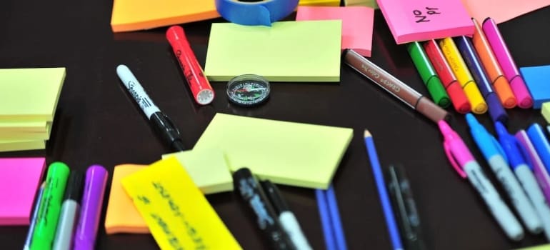 a bunch of sticky notes and pens