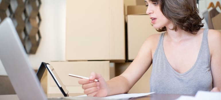 A woman selling boxes online