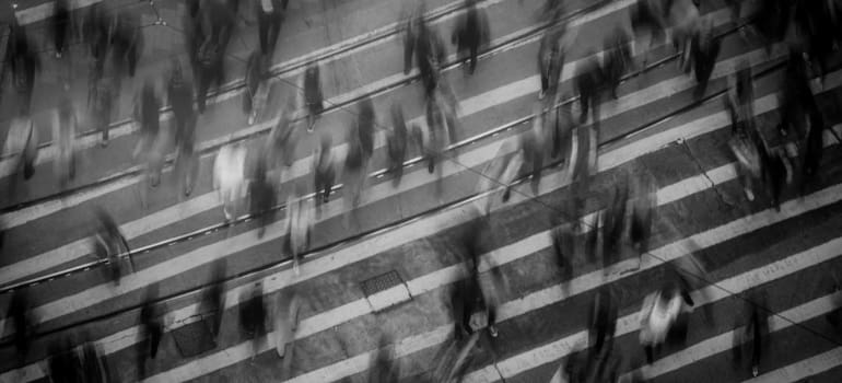 a crowd of people on a crosswalk