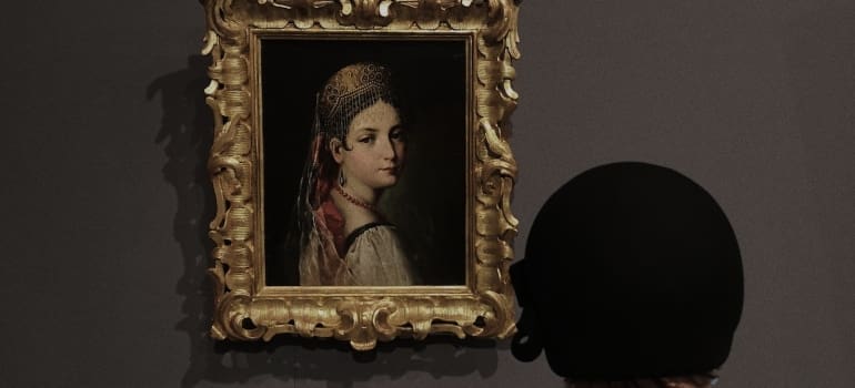 a person watching a painting 